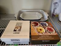Boxed Brie baker, boxed appetizer plates, Emile Henry dish visible behind