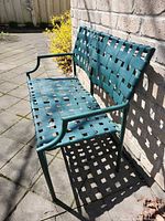 Full view of bench against brick wall