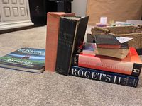Group shot of all visible books on carpet