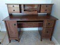 front view of full desk showing hutch drawers and lower storage