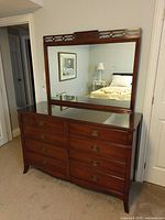 Front view of dresser with mirror and glass top