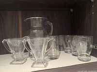 Entire set showing creamer, sugar bowl, pitcher, tumbler and glasses