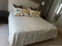 Full view of bed showing duvet cover and pillows