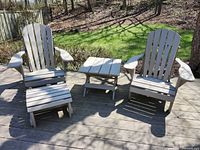 Overall view of two Muskoka chairs, footstool and side table on deck
