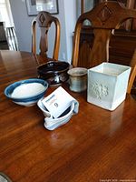 All five pottery items on table