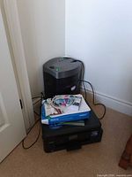 Printer, shredder, paper and cartridges stacked together