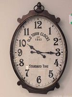 Full view of oval Old Town Clocks wall clock