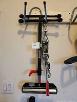 Full view of JobMate roller stand with come-along puller hanging beside