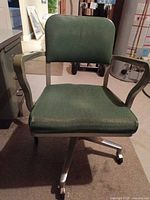 Front view of Steelcase office chair showing upholstery, arms, base