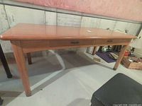 overall view of wood dining table front and drawers