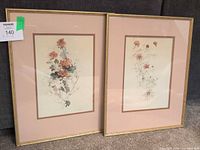 Both framed floral prints side by side