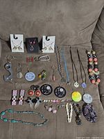 All items laid out on sofa – overview