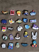 All 25 shoe charms laid out on fabric