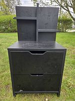Front view showing two drawers and shelf hutch