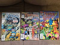 Front covers of all three comics in lot
