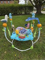 Front view of Disney Baby Finding Nemo Sea of Activities Jumper showing seat, character toys and support legs
