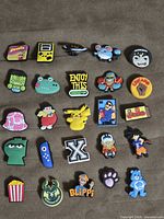 Full set of 24 charms laid out on surface