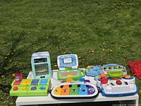 Overview of all six toys on table outdoors