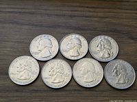 Seven Washington quarters obverse side displayed