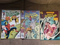 Front covers of three Marvel Spider-Man comic books