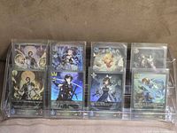 All eight foil cards displayed in two rows on acrylic stand