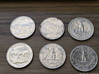 Front view of six quarters showing reverse designs