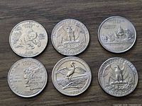 Six quarters reverse sides showing designs