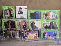 Full lot of 11 sleeved She-Hulk cards displayed on stand
