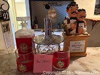 Overall lot view with decanter, dispenser set, extra glasses and figurine