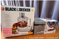 Front of both boxed items showing product images and branding