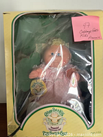 Front view of boxed Cabbage Patch Kids Preemie doll showing doll and packaging