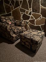 Armchair and ottoman together showing upholstery and general condition