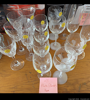 overview showing all sixteen stemmed glasses: cut crystal flutes and wine glasses, plus frosted leaf etched goblets and flutes