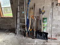 Group view showing ladder, wire plant supports, assorted long-handle tools