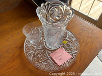 Vase, tumbler and tray grouped on table