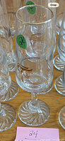 Close-up of individual glass showing graphic and condition