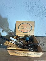 Overall view of crate and mixed tools