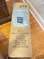 Sealed carton showing product label, model BS-03A, maker UrbanLife, dimensions and shipping info