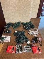 All string lights laid out on table showing bundles, boxed sets and decorative strands