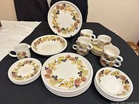 Entire 31-piece Sadler Clover stoneware set laid out
