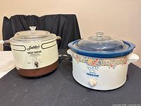 Jubilee deep fryer and Rival Crock-Pot with lids and cords on tabletop
