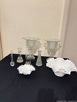 Group shot showing both Fenton bowls, two tall diamond pattern vases, and four bud vases