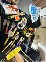 Assorted painting and plaster supplies on table