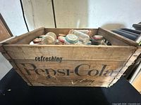 Crate exterior showing Pepsi-Cola graphics and contents of Heinz baby food jars