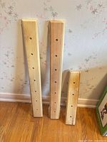 Three pine coat racks showing lengths and pre-drilled holes
