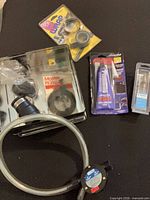 Overall view showing pump, adhesive, tape, cartridge and other items