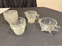 Group view of all Pyrex custard cups and two sugar bowls