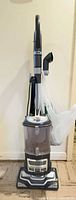 Full view of Shark Navigator Lift-Away vacuum with hose, wand and attachments attached