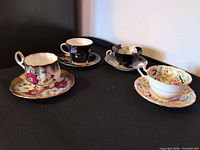 Group shot of four teacup and saucer sets