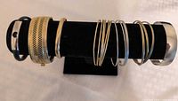 all bracelets displayed on stand showing variety and condition
